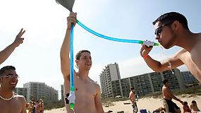 Beach party with topless hunk dudes and sexy ladies