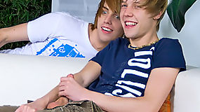 A nerdy twink surprises his friend masturbating to porno