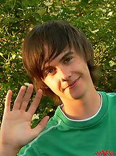 Boy with long hairs outdoor posing